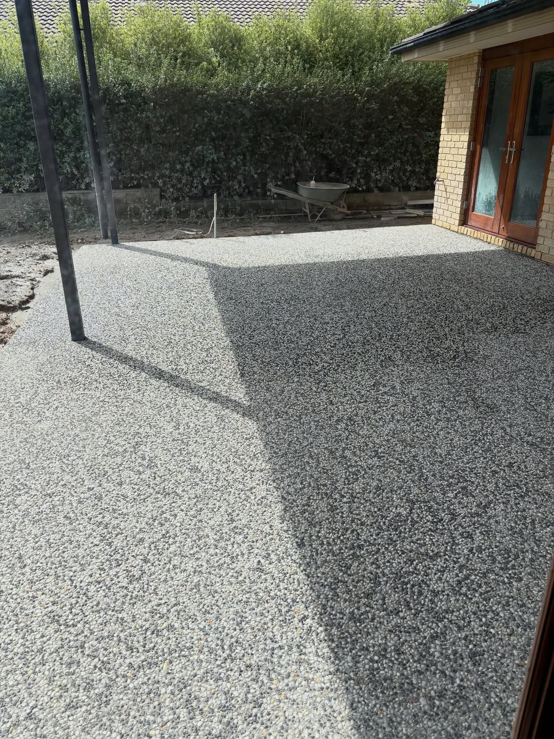 Exposed aggregate concrete patio freshly laid